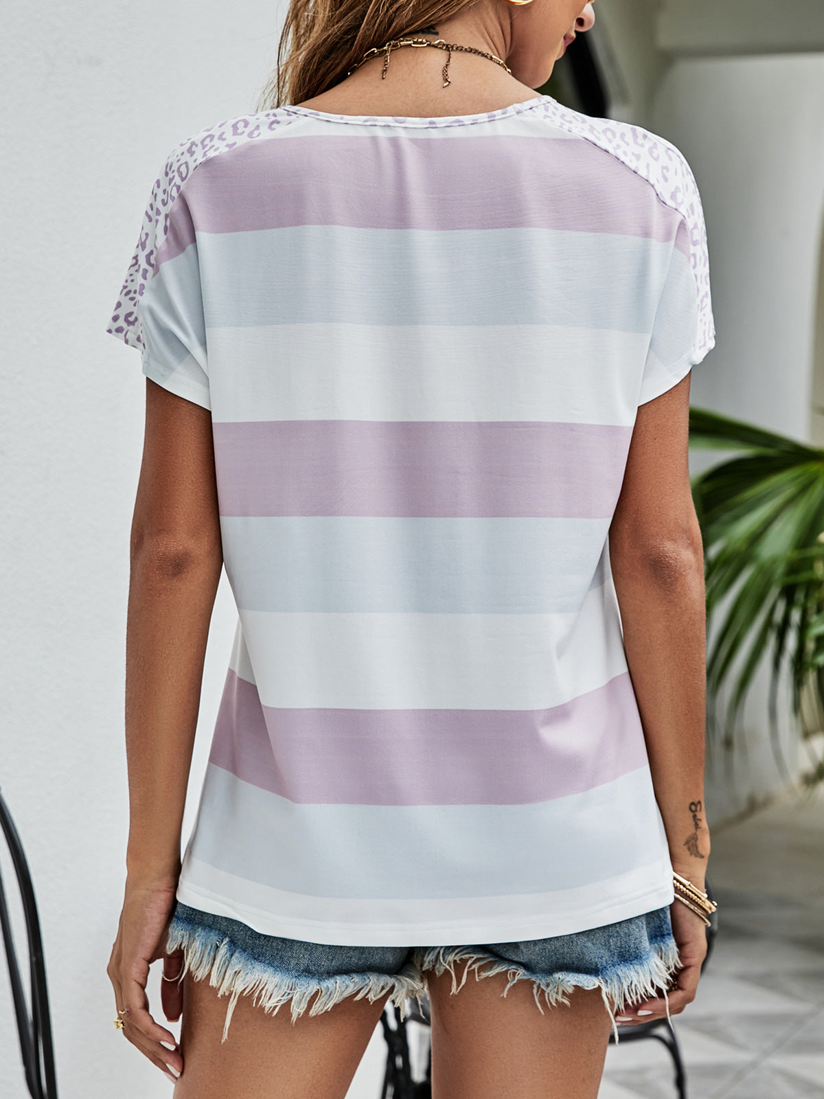 Leopard Striped V-Neck Tee showcasing a trendy animal print design, perfect for casual wear.