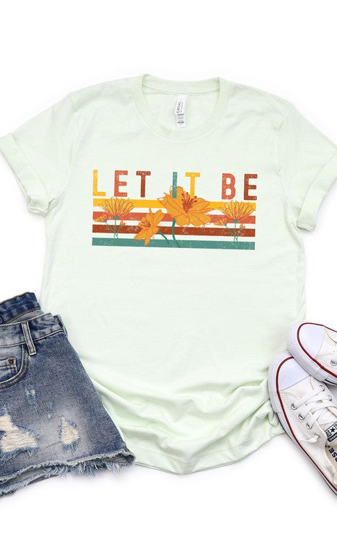 Let It Be Graphic Tee PLUS in white and cream colors, showcasing a stylish graphic design, perfect for casual wear.