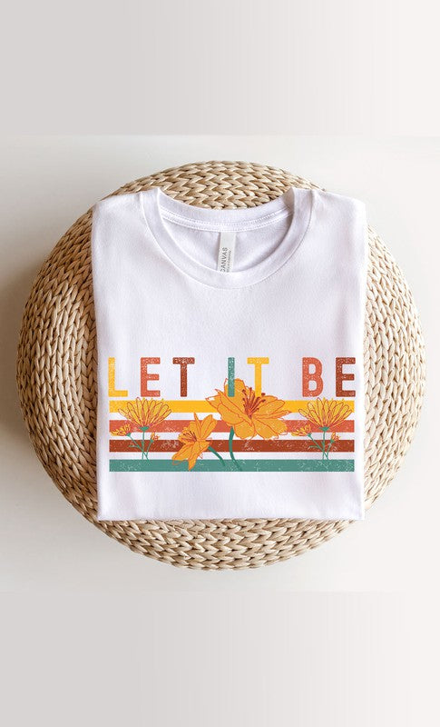 Let It Be Graphic Tee PLUS in white and cream colors, showcasing a stylish graphic design, perfect for casual wear.