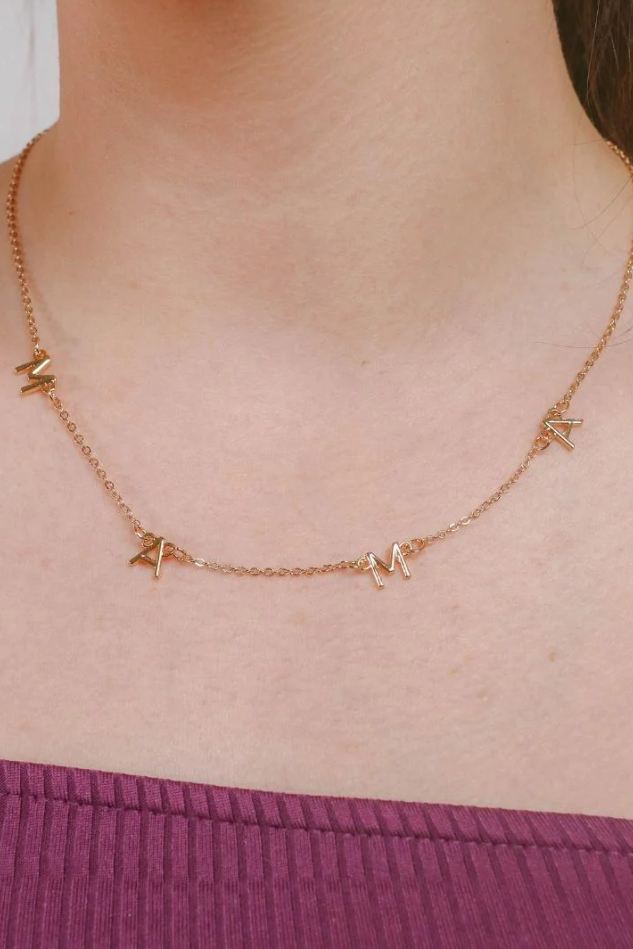 Elegant gold letter necklace with 'MOM' inscription, crafted from 100% brass.