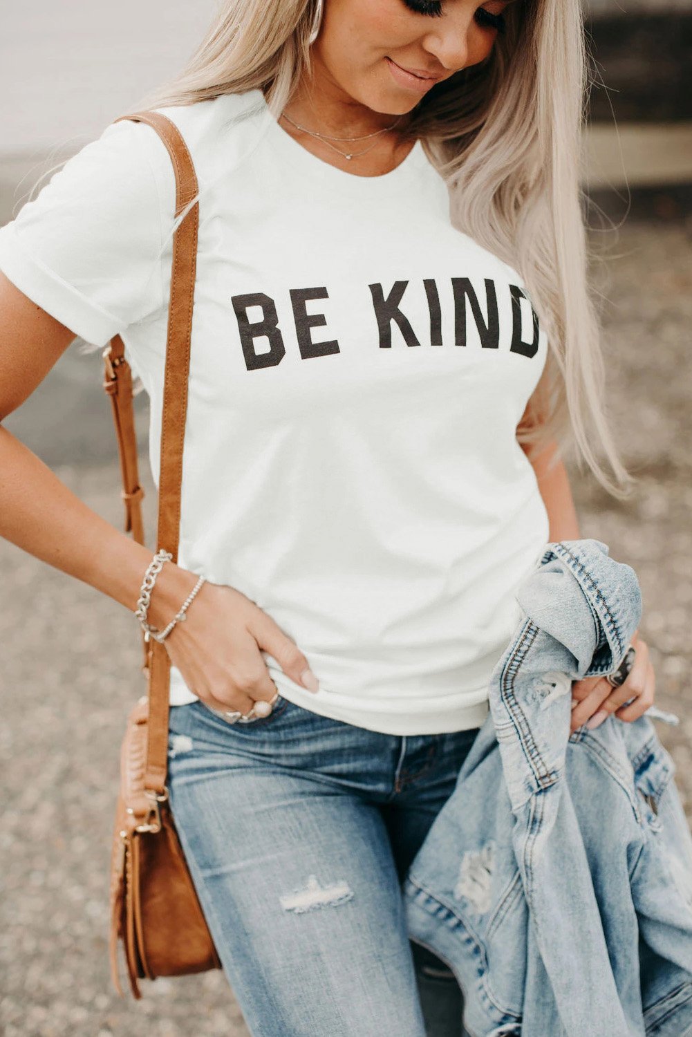 A pure white short sleeve tee featuring a stylish letter print, perfect for summer wear.