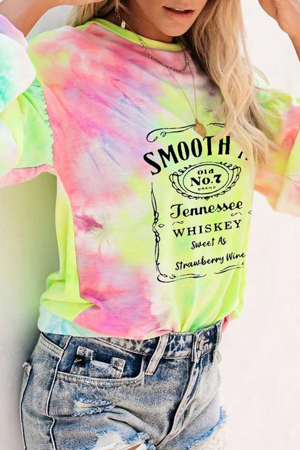 A vibrant multicolor tie-dye sweatshirt featuring a trendy letters graphic print on the front, showcasing a relaxed fit and drop sleeves design.