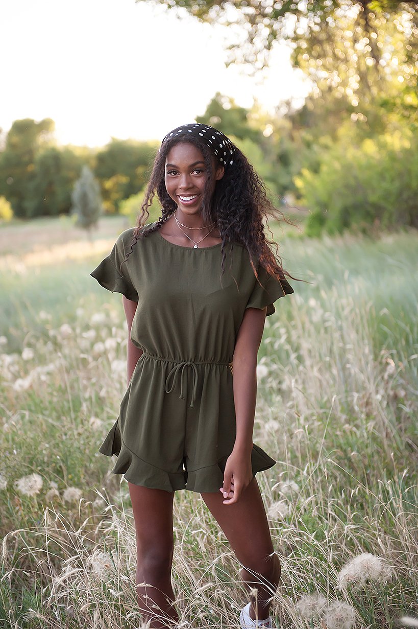 Lexie Ruffle Hem Romper in Olive featuring ruffle sleeves and adjustable waistband, perfect for summer wear.