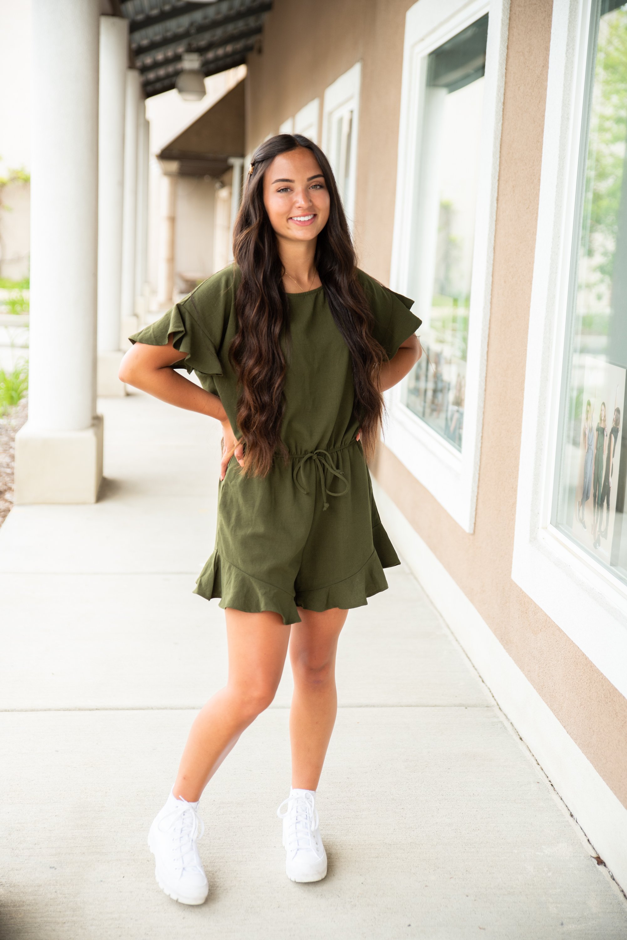 Lexie Ruffle Hem Romper in Olive featuring ruffle sleeves and adjustable waistband, perfect for summer wear.