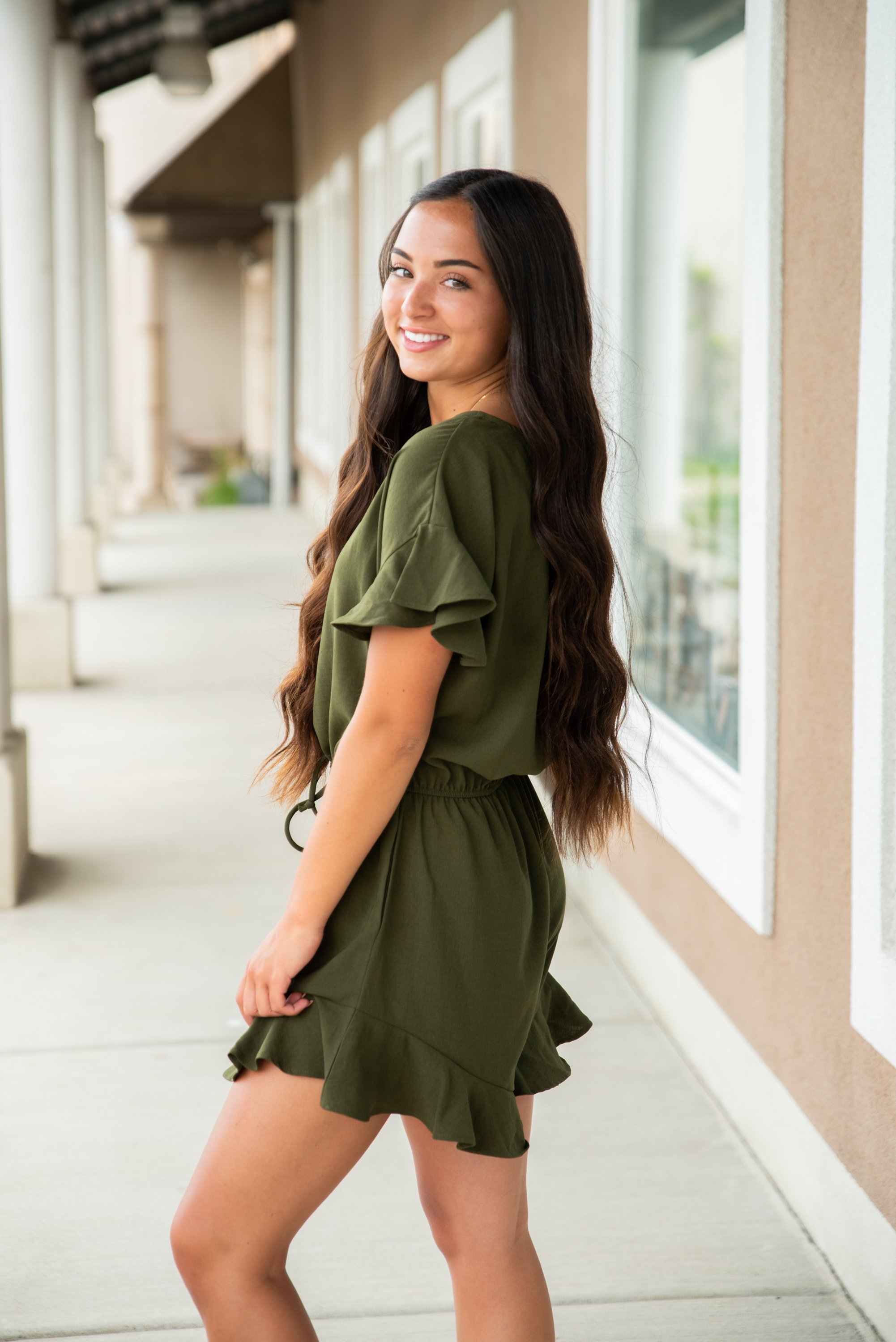 Lexie Ruffle Hem Romper in Olive featuring ruffle sleeves and adjustable waistband, perfect for summer wear.