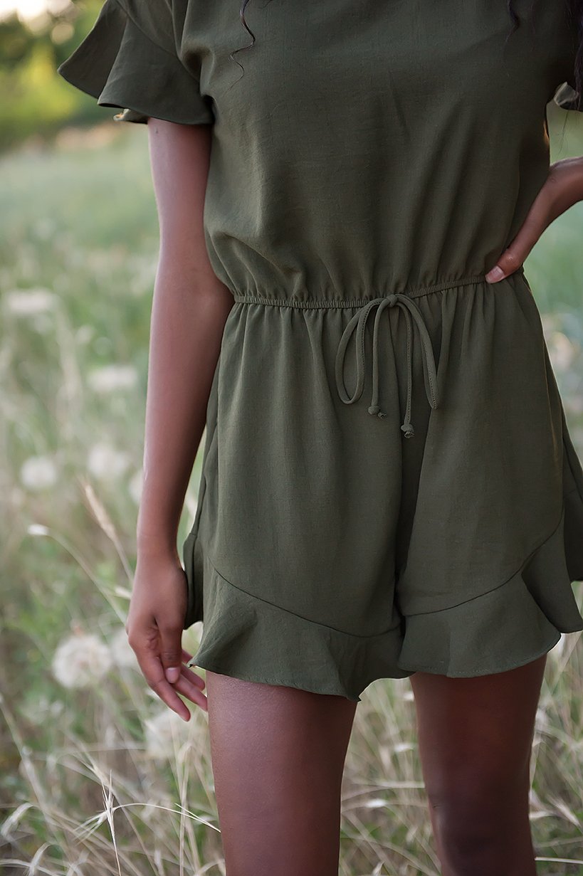 Lexie Ruffle Hem Romper in Olive featuring ruffle sleeves and adjustable waistband, perfect for summer wear.