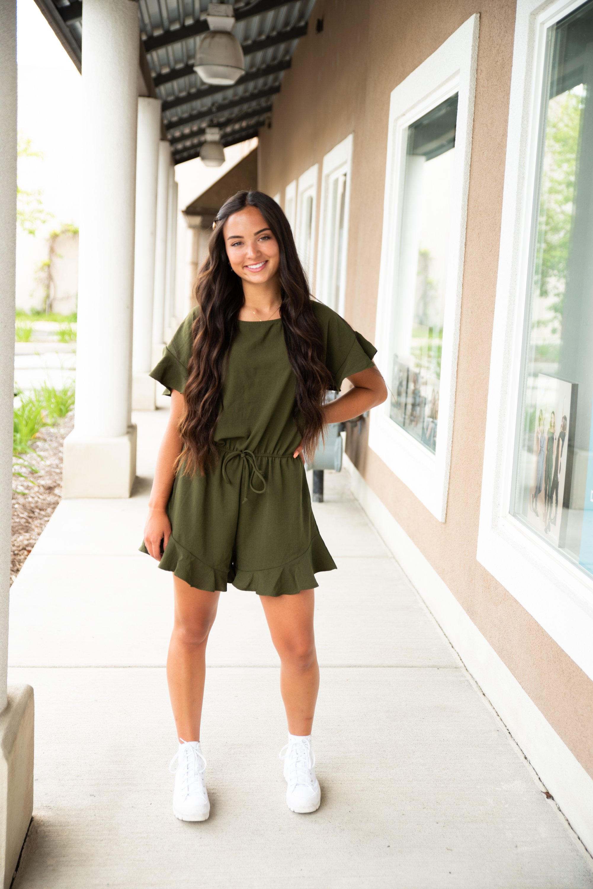 Lexie Ruffle Hem Romper in Olive featuring ruffle sleeves and adjustable waistband, perfect for summer wear.