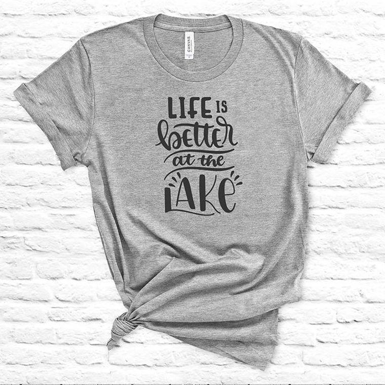 A comfortable unisex t-shirt featuring the phrase 'Life is Better at the Lake' printed in vibrant colors, perfect for lake lovers.