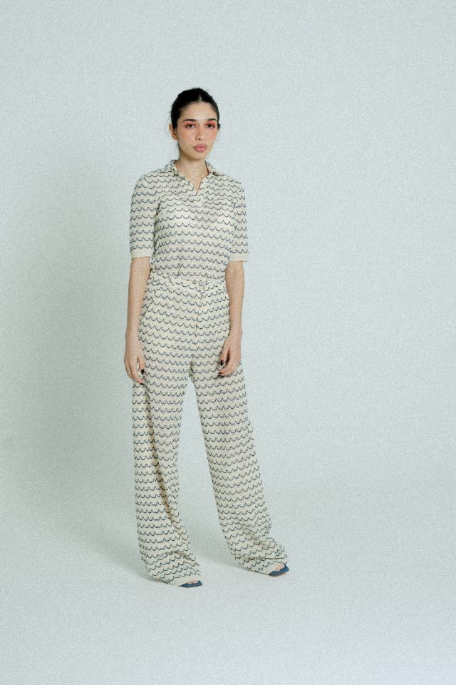 Light Weight Cotton Knit Long Wide Trousers in Marine with beige and marine blue wave pattern, featuring side pockets and wooden effect button.