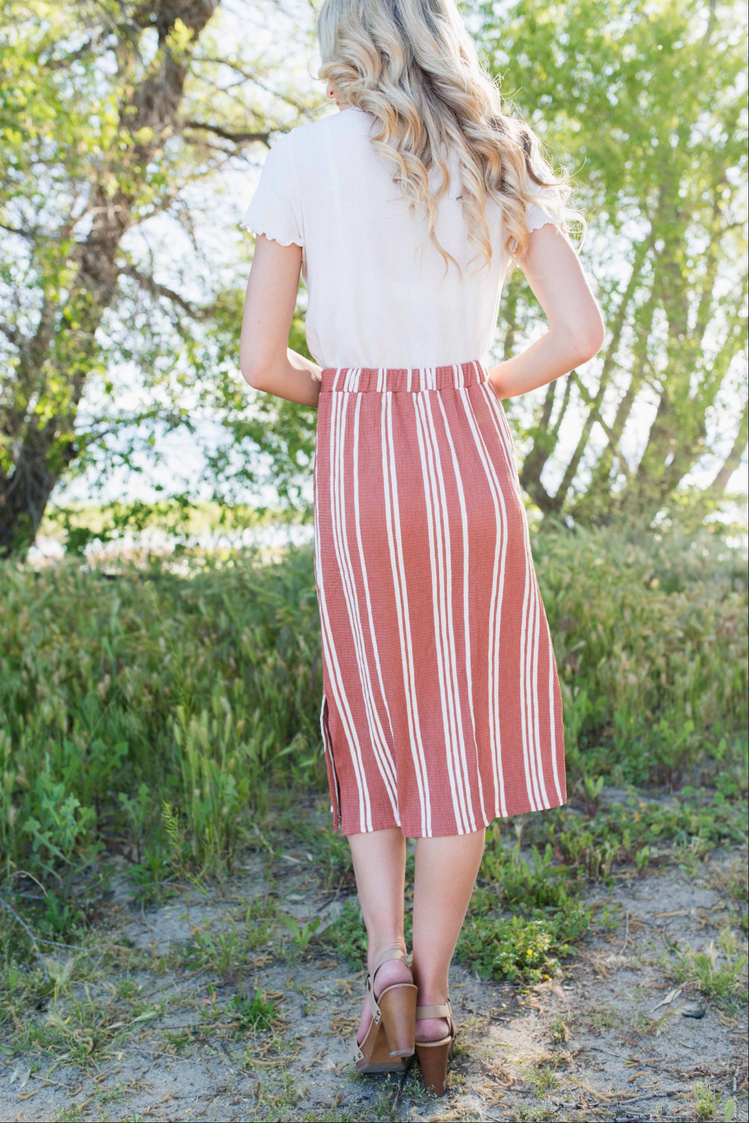 Linen Buttoned Paperbag Midi Skirt featuring a trendy striped design, mid-thigh button-down style, and comfortable paperbag waist.