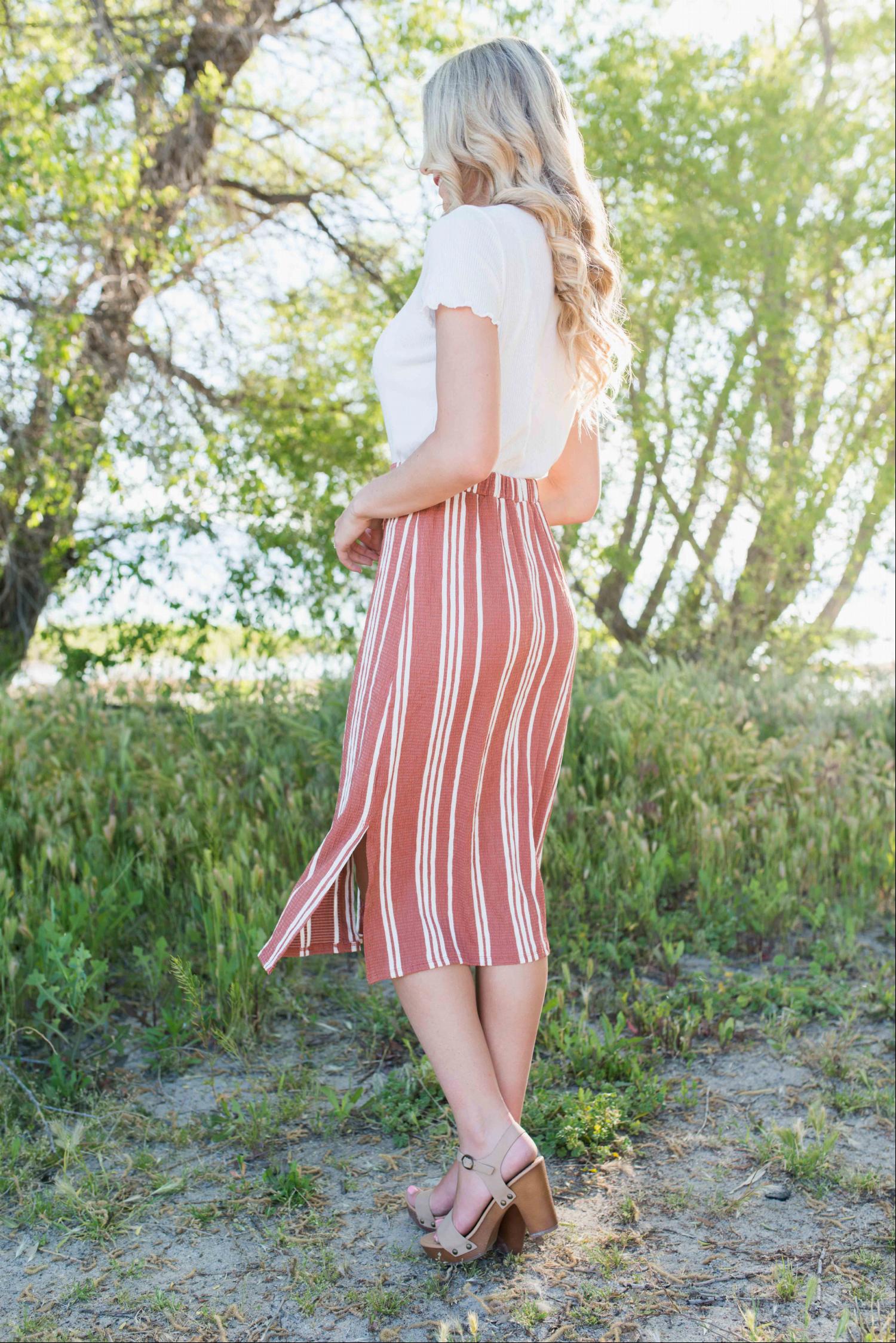 Linen Buttoned Paperbag Midi Skirt featuring a trendy striped design, mid-thigh button-down style, and comfortable paperbag waist.