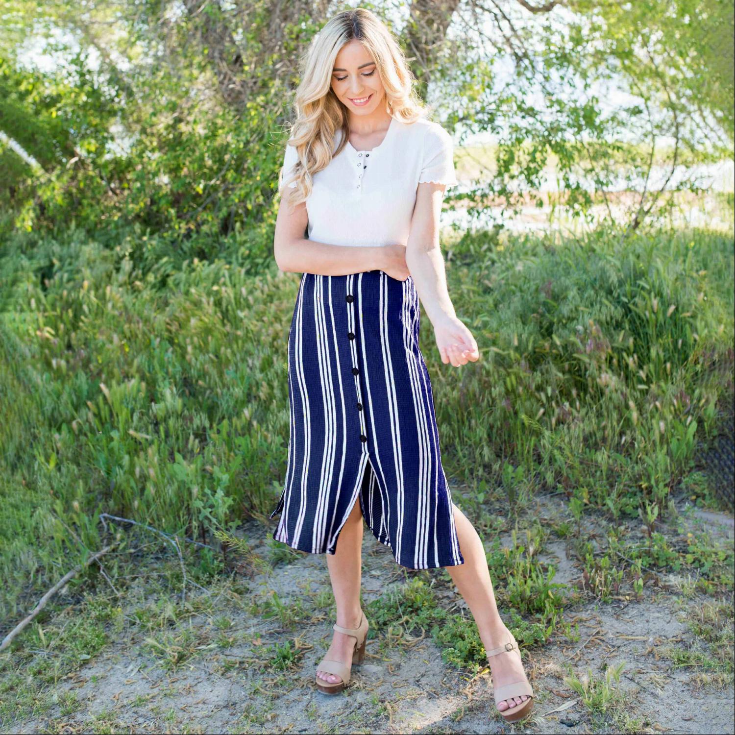 Linen Buttoned Paperbag Midi Skirt featuring a trendy striped design, mid-thigh button-down style, and comfortable paperbag waist.