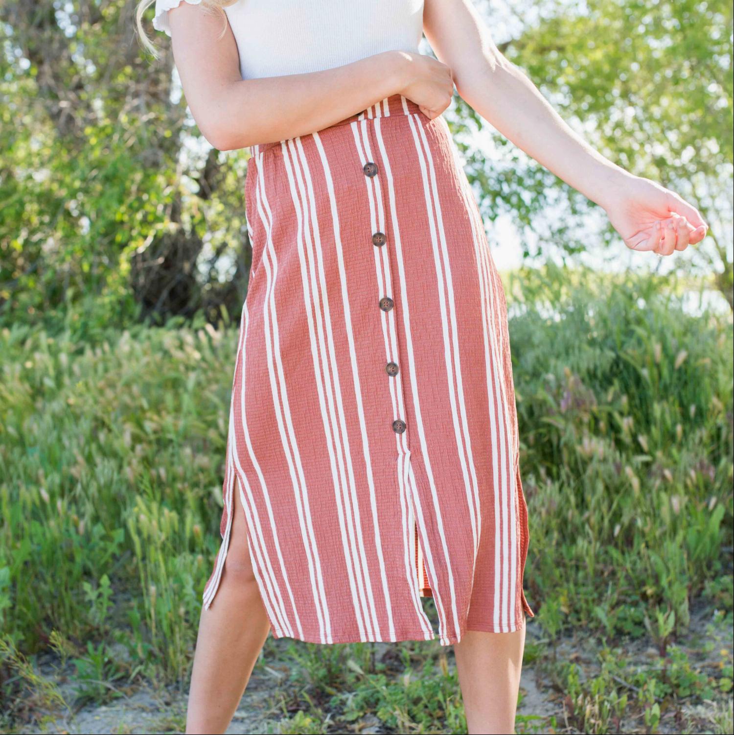 Linen Buttoned Paperbag Midi Skirt featuring a trendy striped design, mid-thigh button-down style, and comfortable paperbag waist.