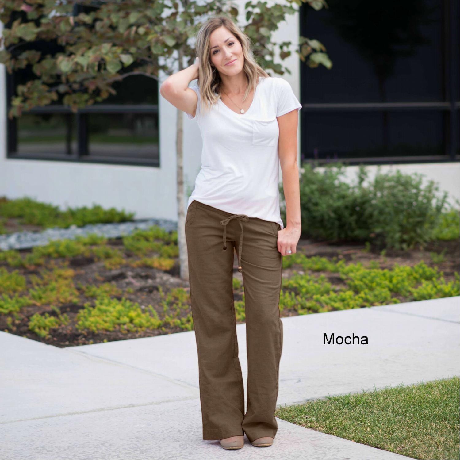 A pair of stylish linen work pants featuring a drawstring waist, perfect for both casual and professional settings.