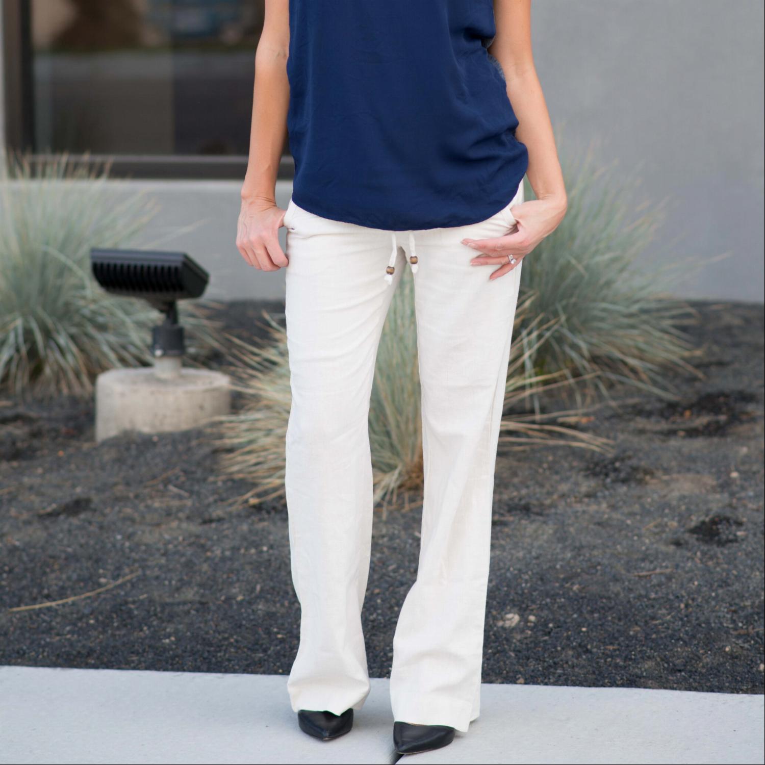 A pair of stylish linen work pants featuring a drawstring waist, perfect for both casual and professional settings.