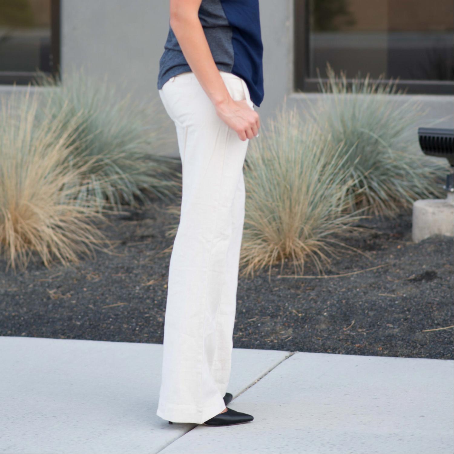 A pair of stylish linen work pants featuring a drawstring waist, perfect for both casual and professional settings.