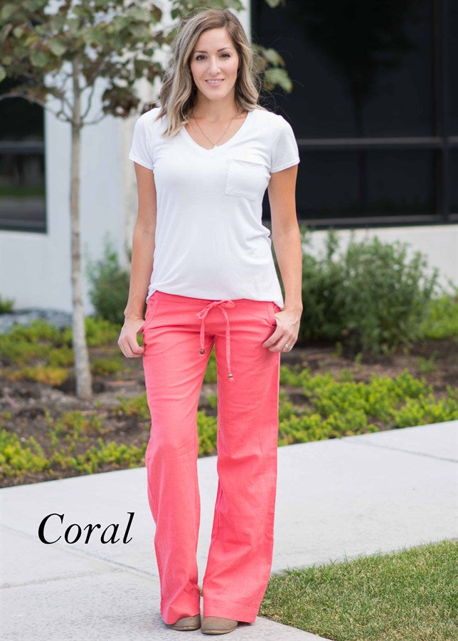 A pair of stylish linen work pants featuring a drawstring waist, perfect for both casual and professional settings.