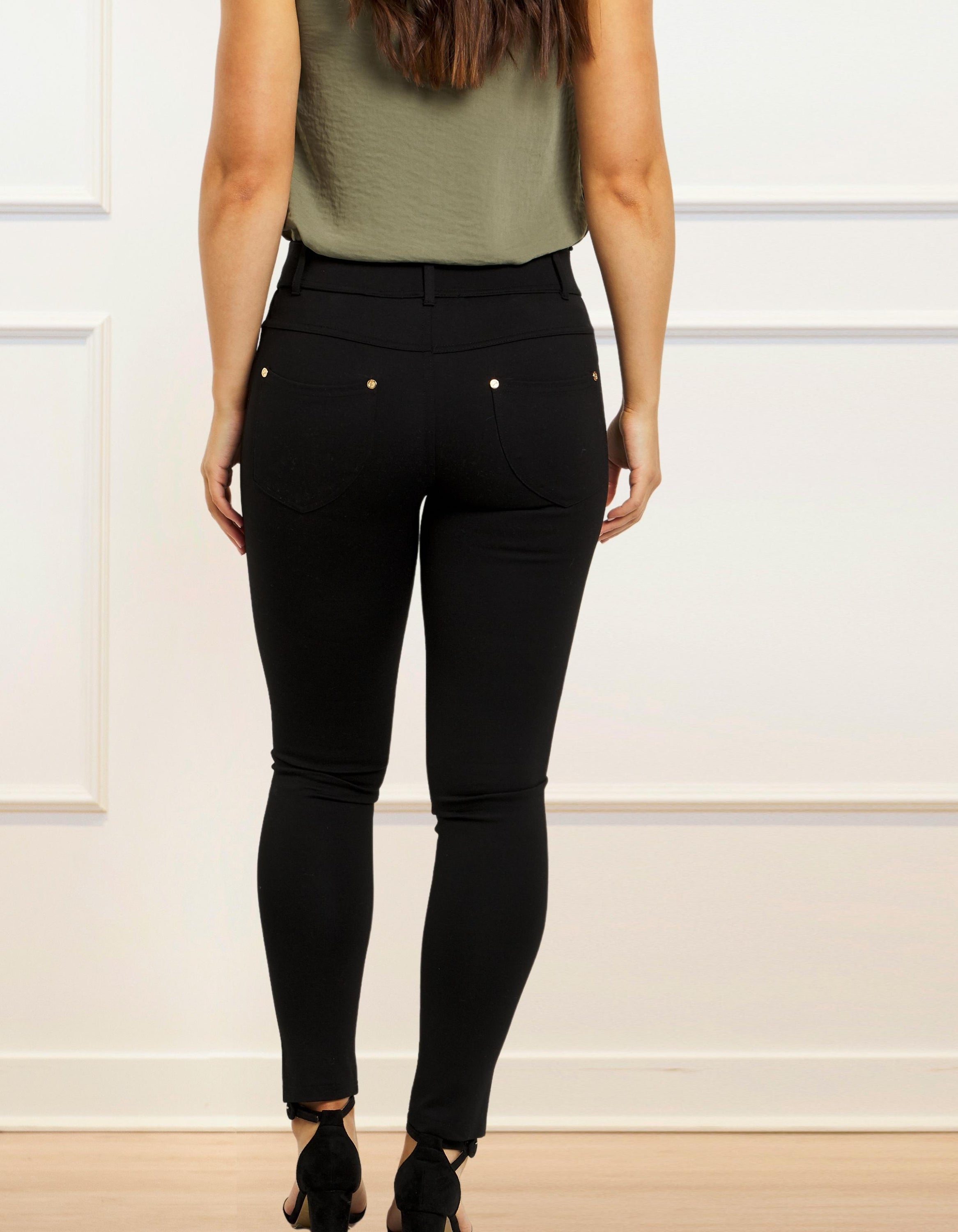 Lisa Stretch Pants in solid black, showcasing a slim fit design with faux front pocket and functional back pockets.