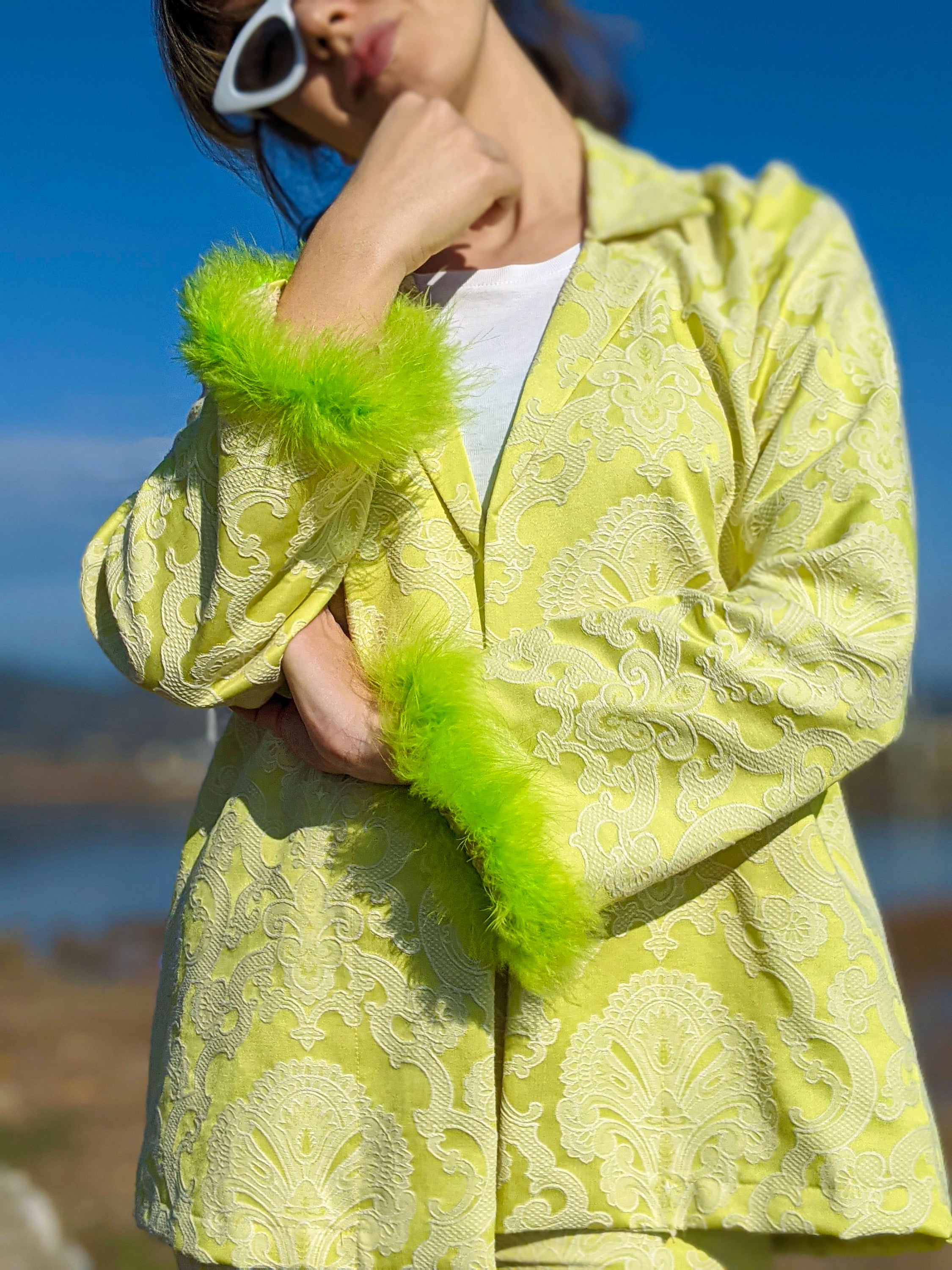 LISSA self-embossed brocade jacket and pants suit with neon green feather details, showcasing a stylish and modern design.