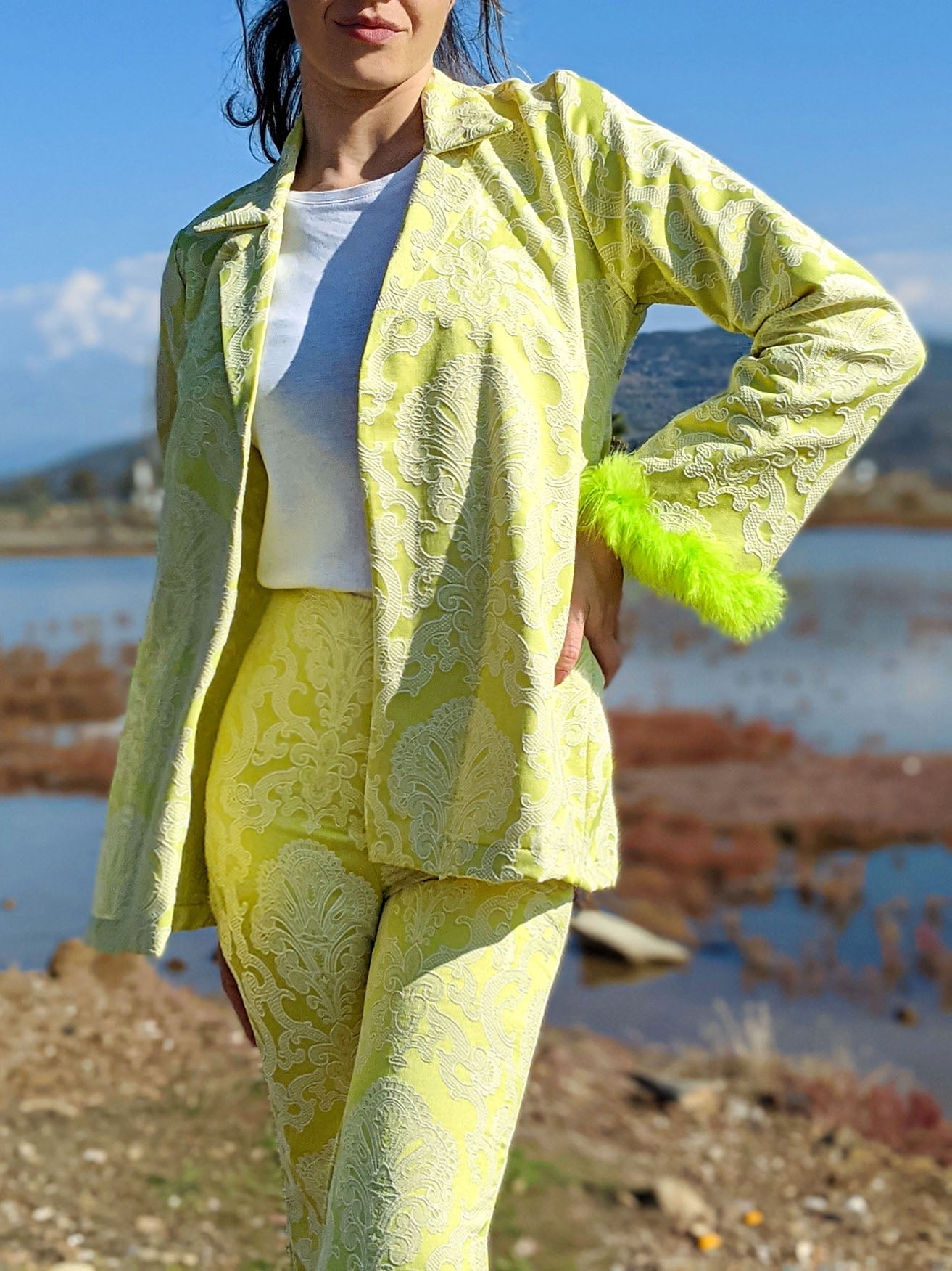 LISSA self-embossed brocade jacket and pants suit with neon green feather details, showcasing a stylish and modern design.