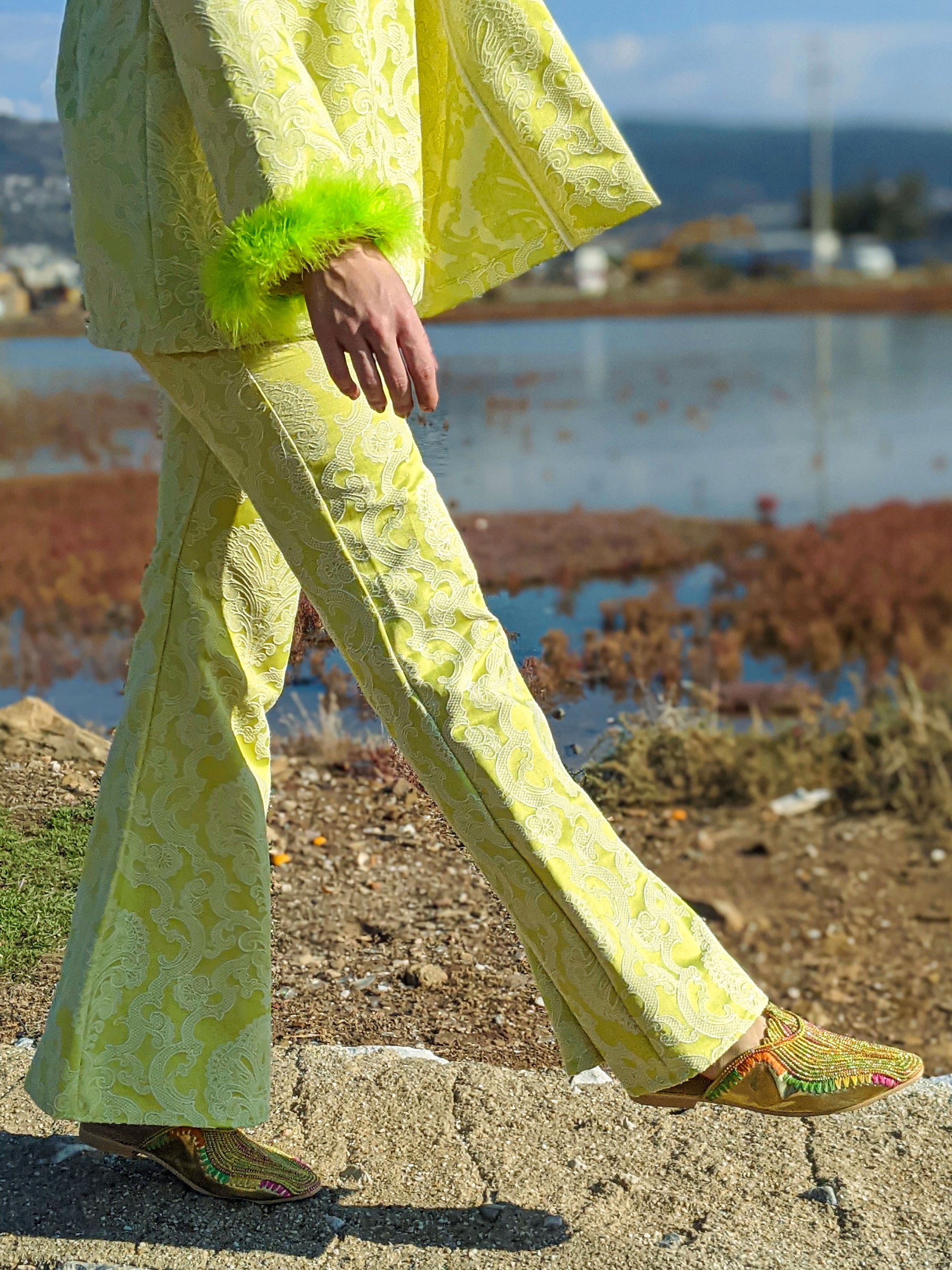 LISSA self-embossed brocade jacket and pants suit with neon green feather details, showcasing a stylish and modern design.