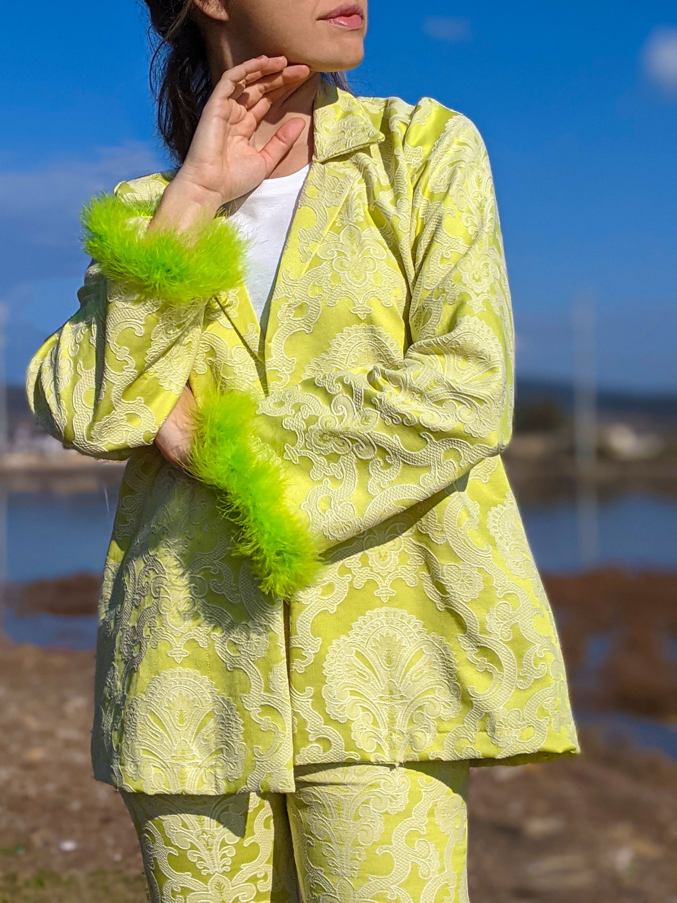 LISSA self-embossed brocade jacket and pants suit with neon green feather details, showcasing a stylish and modern design.