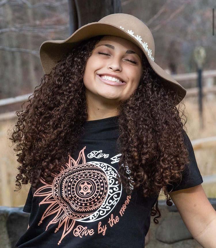 Black graphic tee featuring 'Live By The Sun Love By The Moon' design, showcasing a Bohemian style.