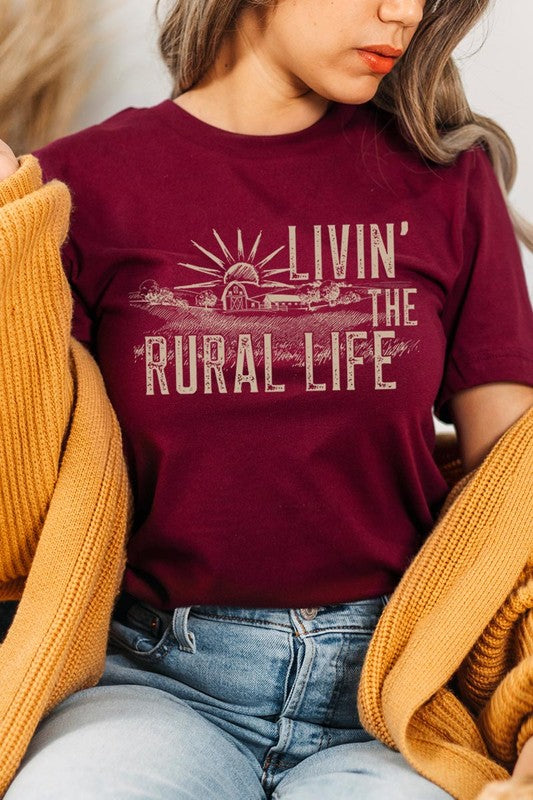 LIVIN THE RURAL LIFE TEE featuring a stylish graphic design, made from 100% cotton, available in various colors.