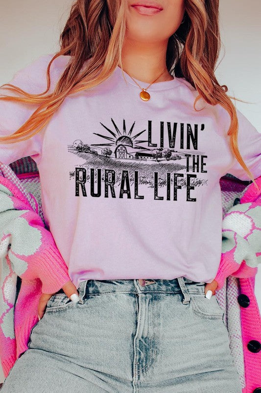 LIVIN THE RURAL LIFE TEE featuring a stylish graphic design, made from 100% cotton, available in various colors.