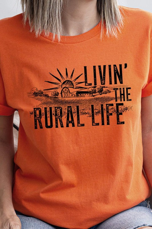 LIVIN THE RURAL LIFE TEE featuring a stylish graphic design, made from 100% cotton, available in various colors.