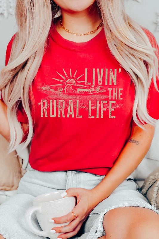 LIVIN THE RURAL LIFE TEE featuring a stylish graphic design, made from 100% cotton, available in various colors.