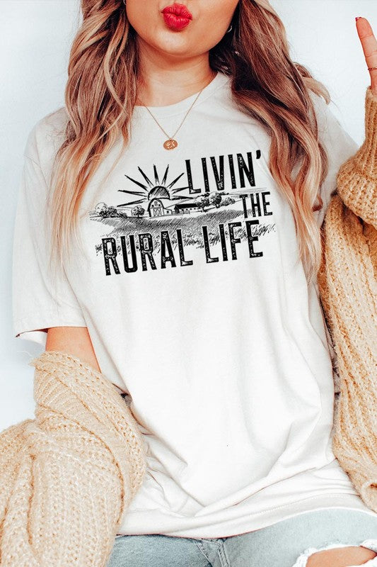 LIVIN THE RURAL LIFE TEE featuring a stylish graphic design, made from 100% cotton, available in various colors.