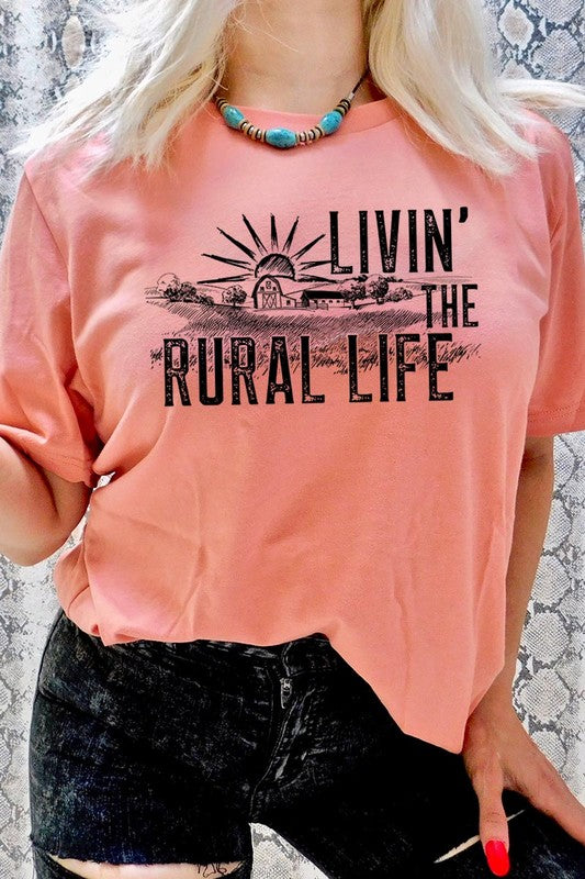 LIVIN THE RURAL LIFE TEE featuring a stylish graphic design, made from 100% cotton, available in various colors.