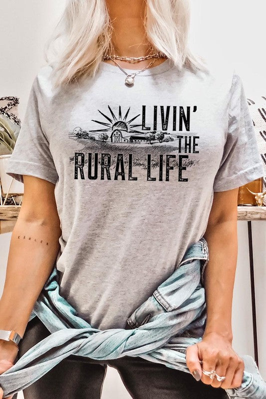 LIVIN THE RURAL LIFE TEE featuring a stylish graphic design, made from 100% cotton, available in various colors.