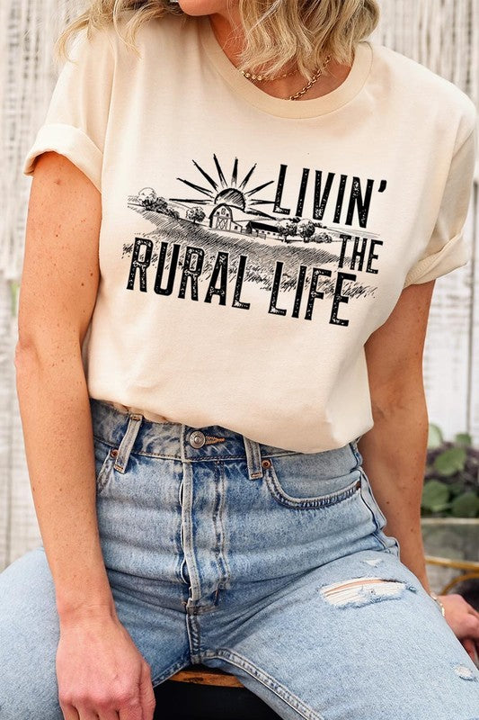 LIVIN THE RURAL LIFE TEE featuring a stylish graphic design, made from 100% cotton, available in various colors.