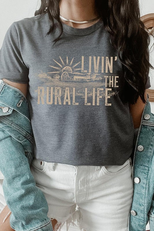 LIVIN THE RURAL LIFE TEE featuring a stylish graphic design, made from 100% cotton, available in various colors.