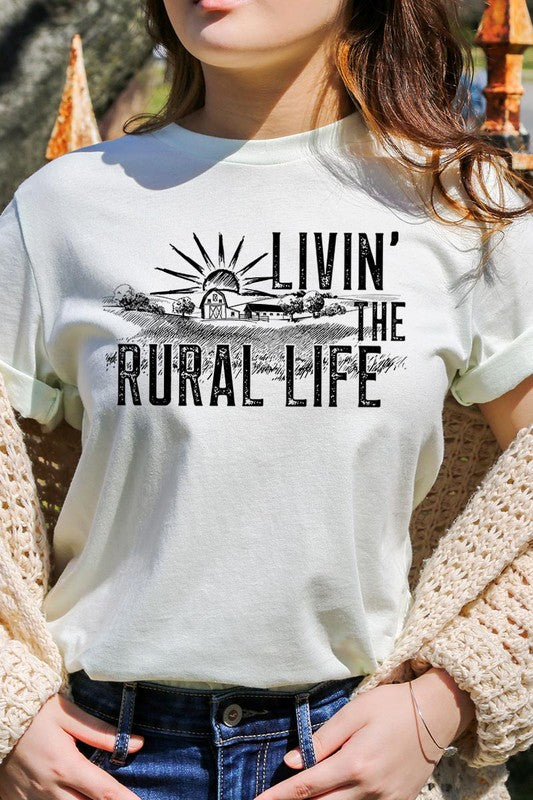 LIVIN THE RURAL LIFE TEE featuring a stylish graphic design, made from 100% cotton, available in various colors.