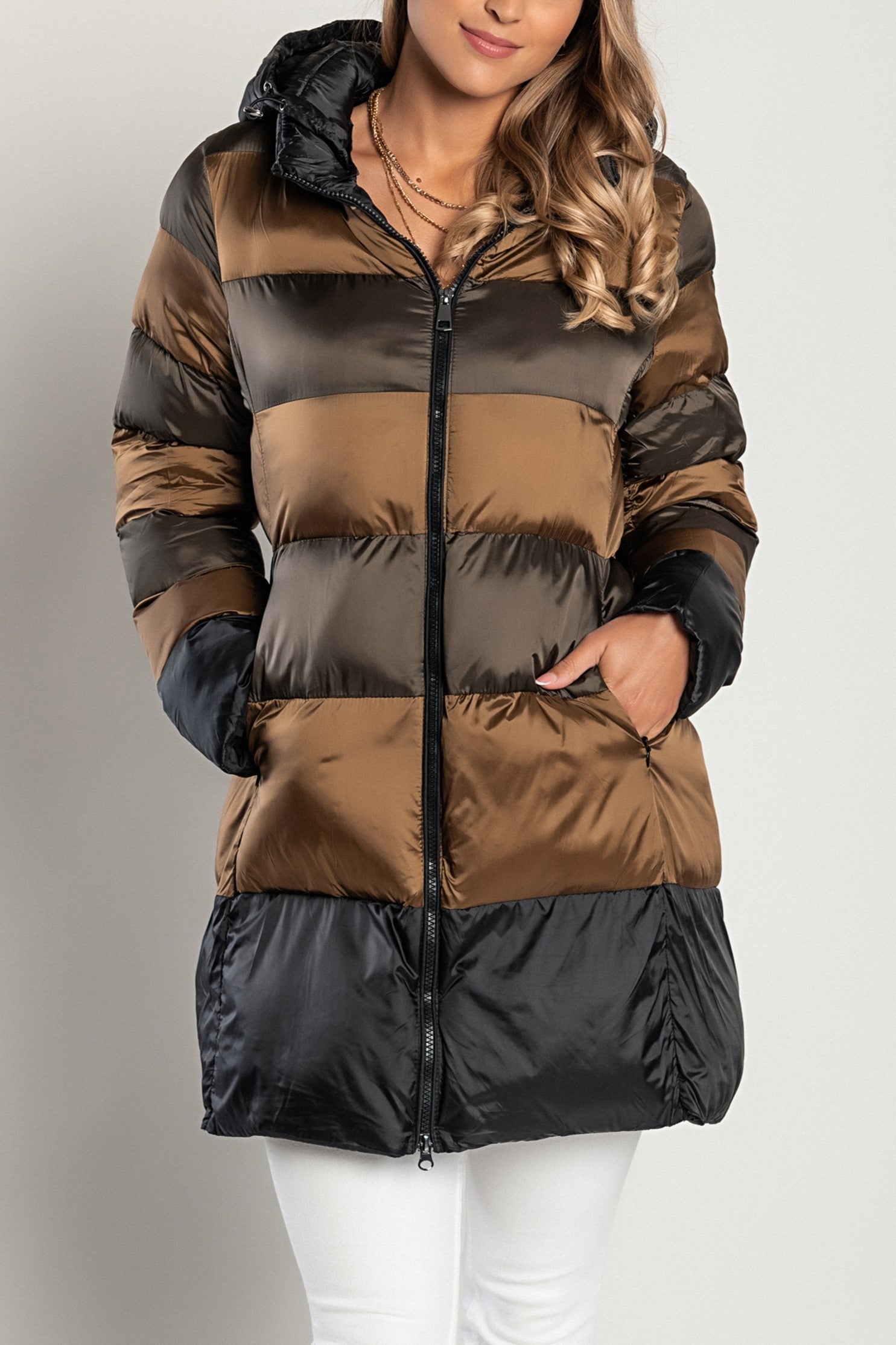 Long camel jacket with hood, high collar, and zip closure, showcasing its stylish design and warm filling.