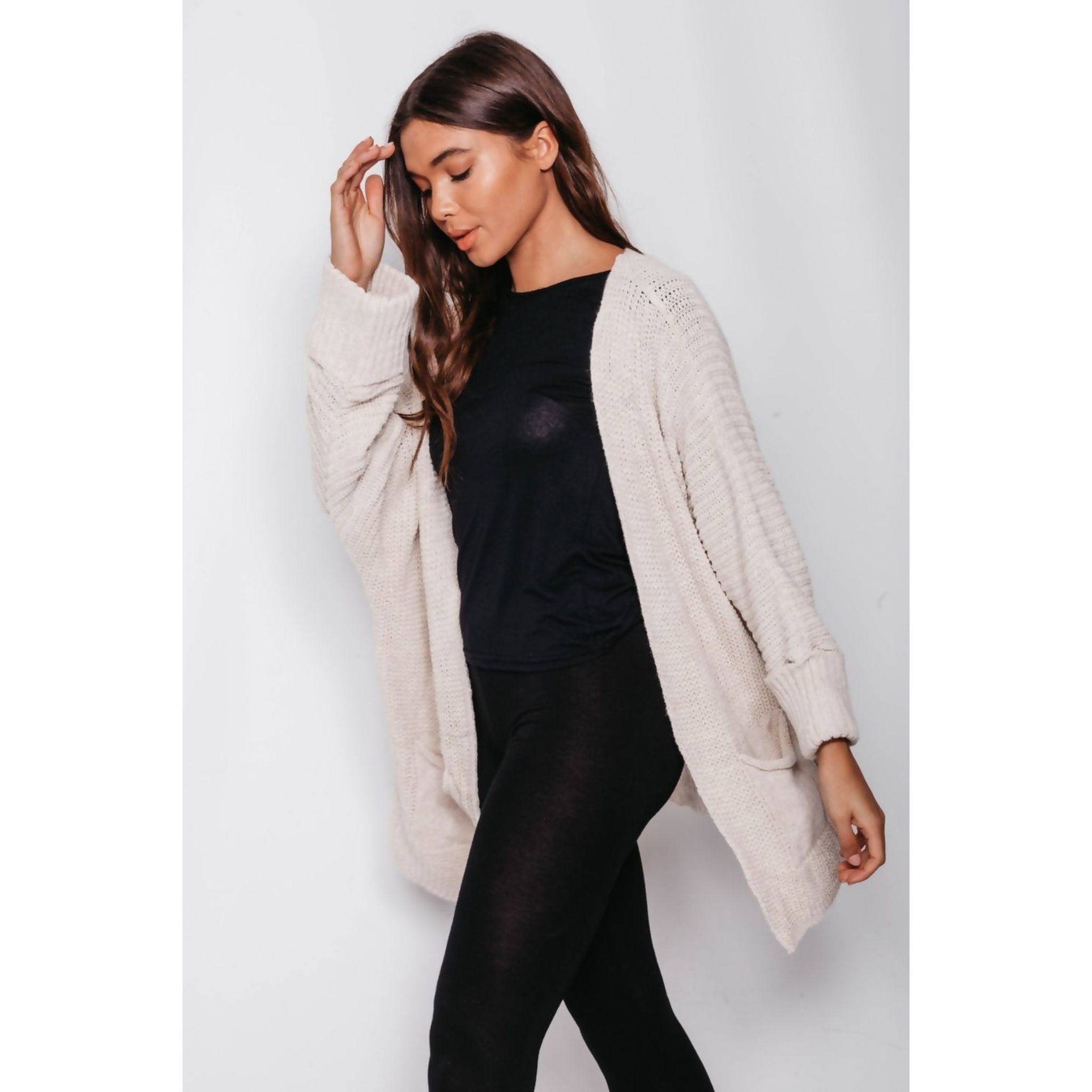 Long Pocket Cardigan in various colours, showcasing its oversized design and pockets.