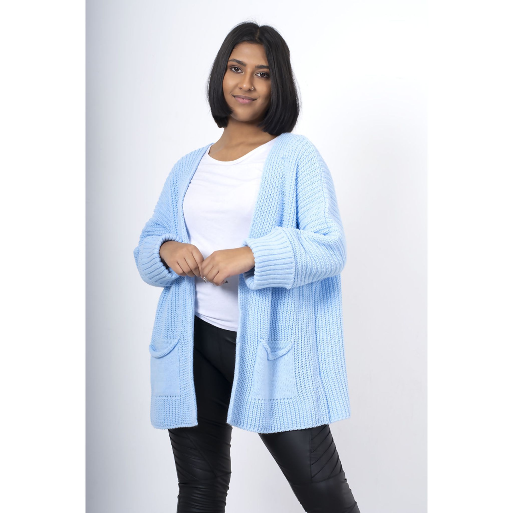 Long Pocket Cardigan in various colours, showcasing its oversized design and pockets.