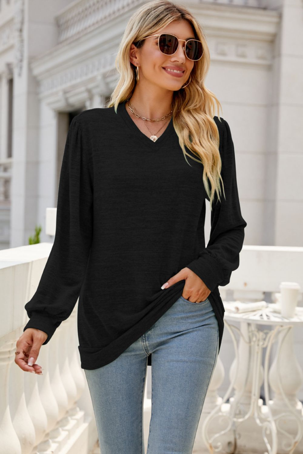 A stylish Long Puff Sleeve V-Neck Top in a solid color, showcasing its elegant puff sleeves and flattering neckline.