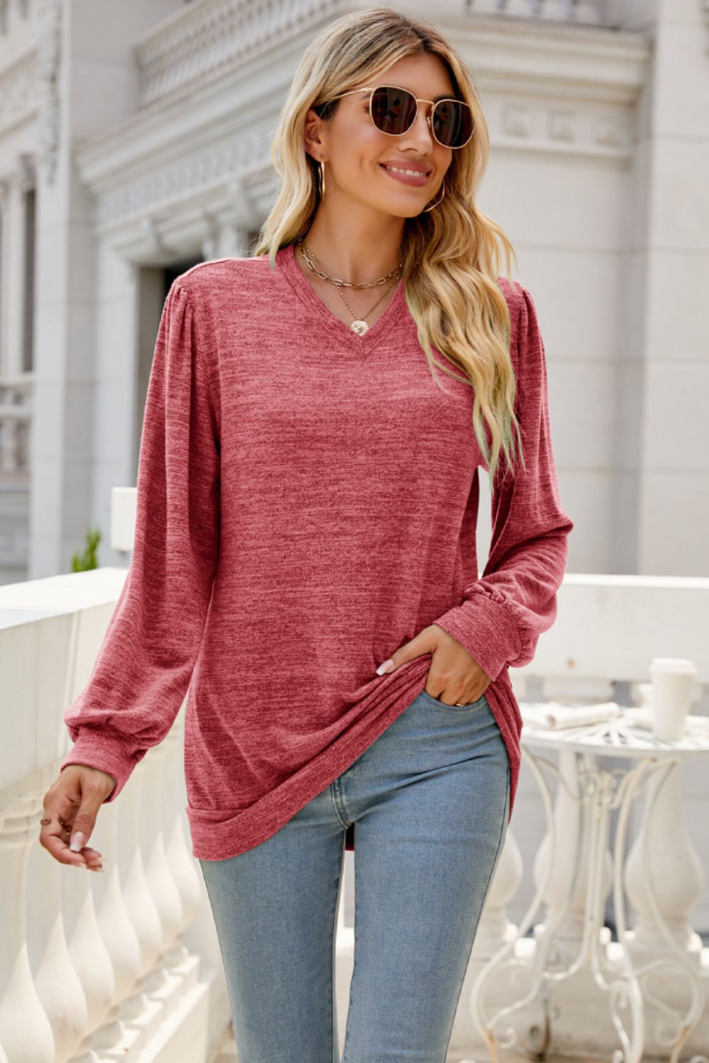 A stylish Long Puff Sleeve V-Neck Top in a solid color, showcasing its elegant puff sleeves and flattering neckline.