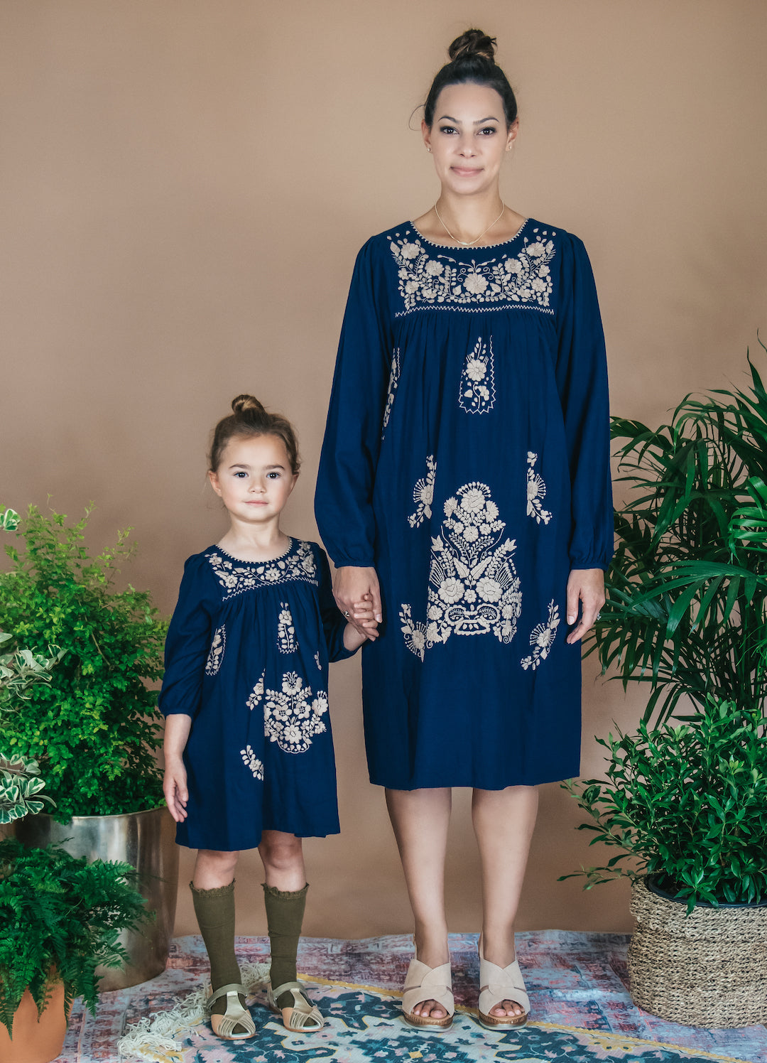 Long Sleeve Autumn Dress in navy blue with tan hand embroidery, showcasing traditional Mayan craftsmanship.