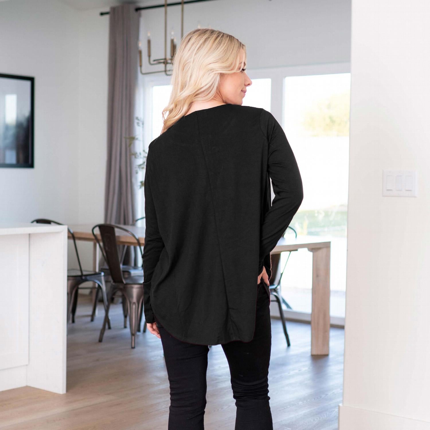 Long Sleeve Dolphin Hem Shell Button Top featuring a round neckline and button detailing, showcasing a loose fit and stylish design.