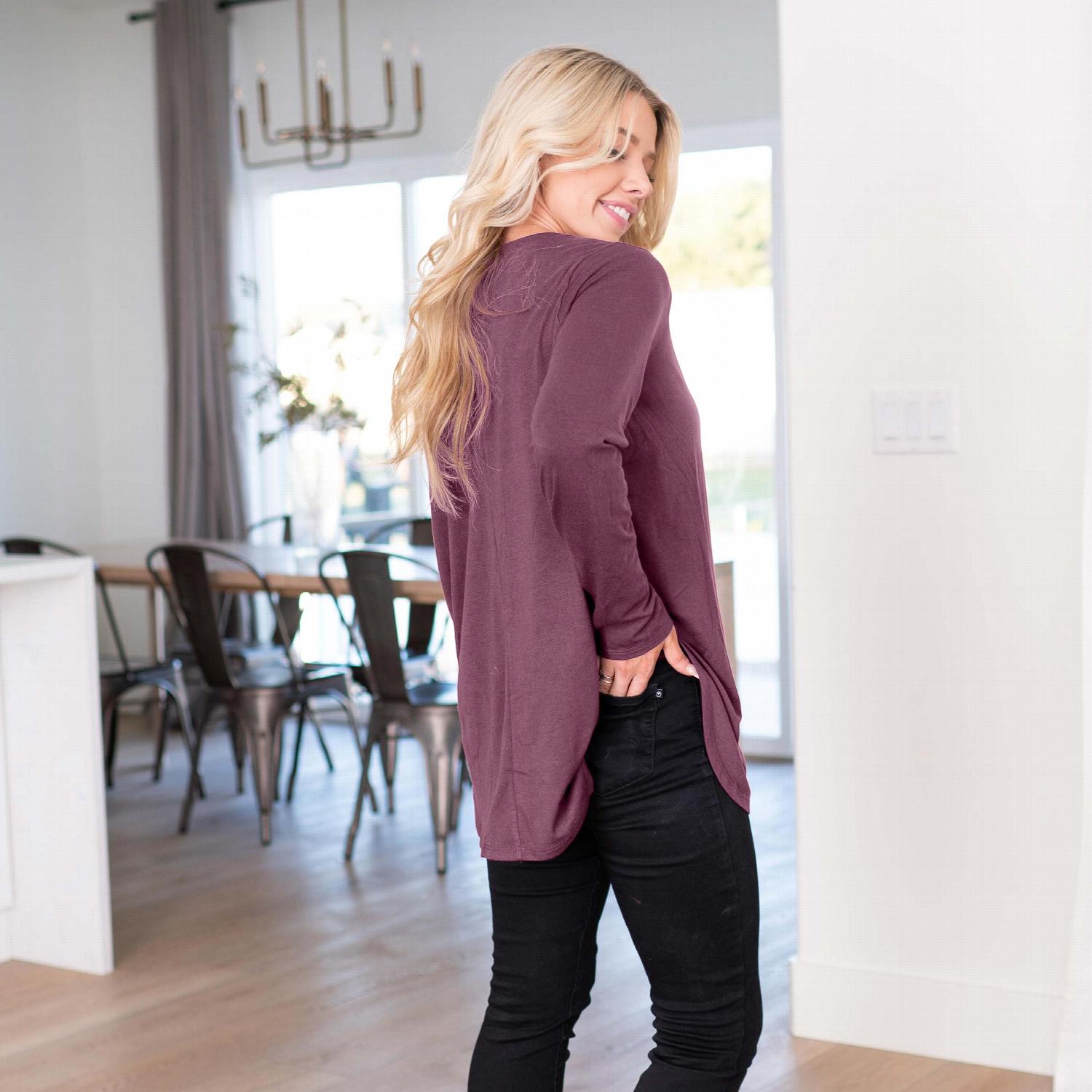 Long Sleeve Dolphin Hem Shell Button Top featuring a round neckline and button detailing, showcasing a loose fit and stylish design.