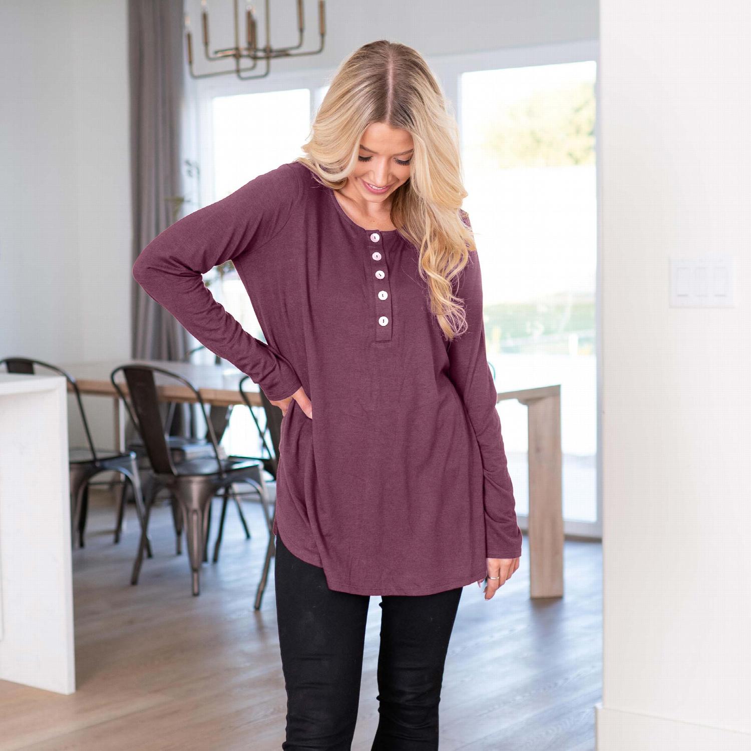 Long Sleeve Dolphin Hem Shell Button Top featuring a round neckline and button detailing, showcasing a loose fit and stylish design.