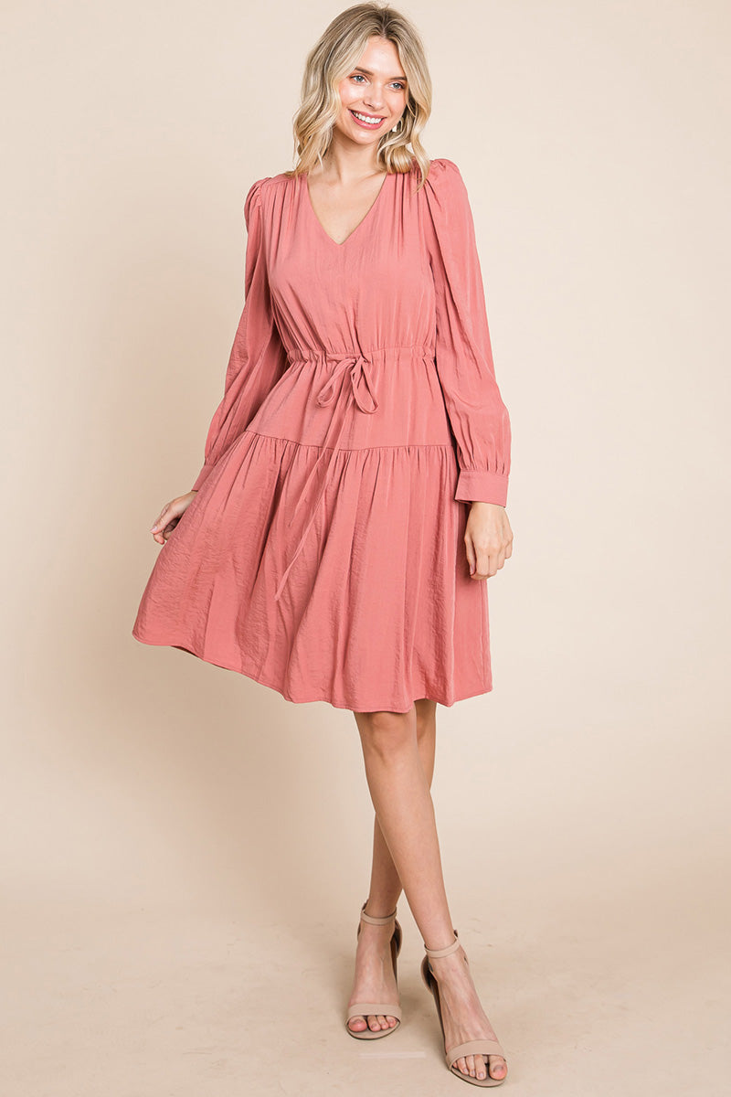 A stylish Long Sleeve Tiered Waist String Ruched Dress featuring a V-neck, long sleeves, and a tiered waist design, perfect for various occasions.