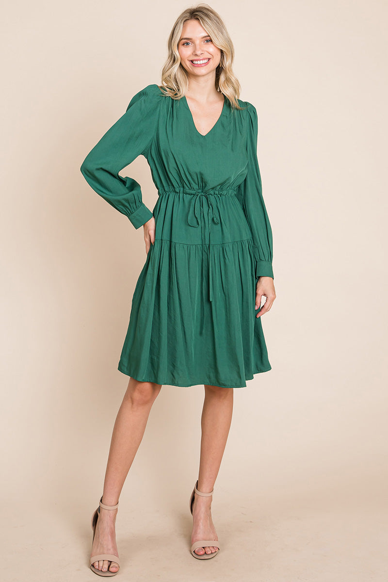 A stylish Long Sleeve Tiered Waist String Ruched Dress featuring a V-neck, long sleeves, and a tiered waist design, perfect for various occasions.