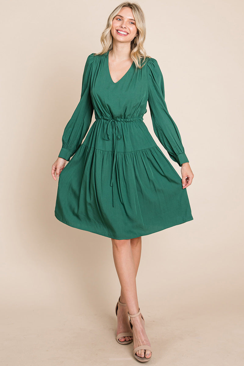 A stylish Long Sleeve Tiered Waist String Ruched Dress featuring a V-neck, long sleeves, and a tiered waist design, perfect for various occasions.