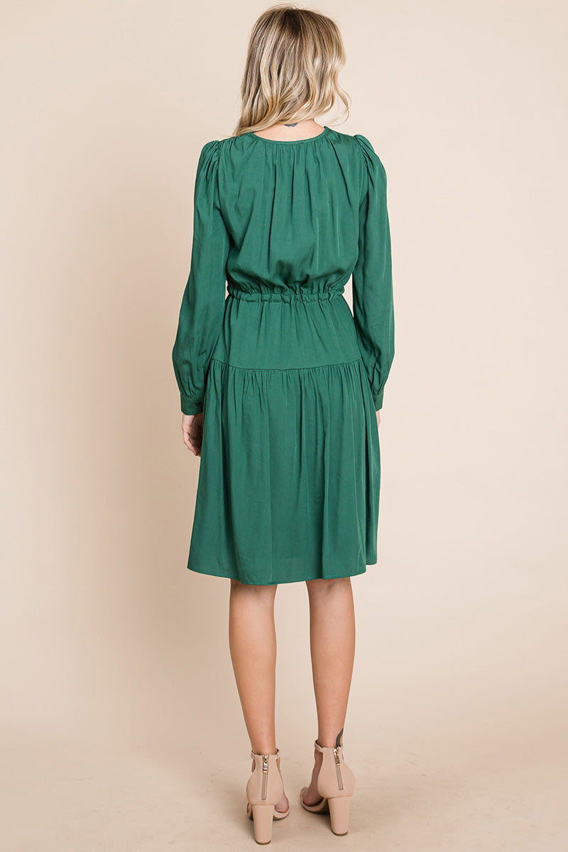 A stylish Long Sleeve Tiered Waist String Ruched Dress featuring a V-neck, long sleeves, and a tiered waist design, perfect for various occasions.